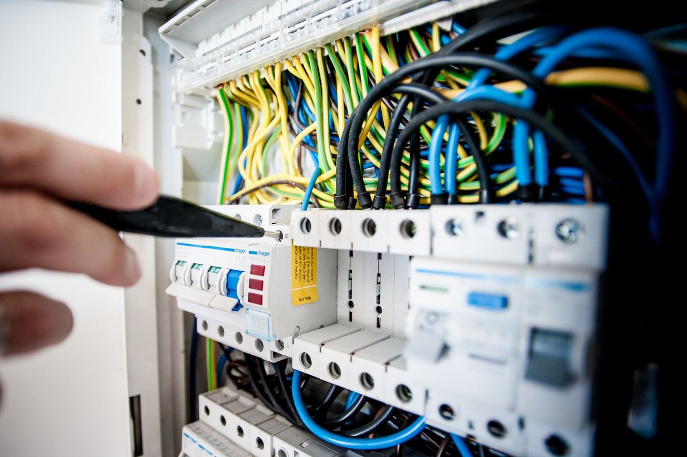 Electrician testing a consumer unit during an electrical inspection